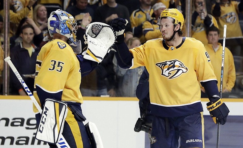 Nashville Predators center Ryan Johansen, right, shown congratulating goaltender Pekka Rinne after a home win in October 2018, has been fined $5,000 for his actions during a game Tuesday night against the Tampa Bay Lightning. / AP photo by Mark Humphrey