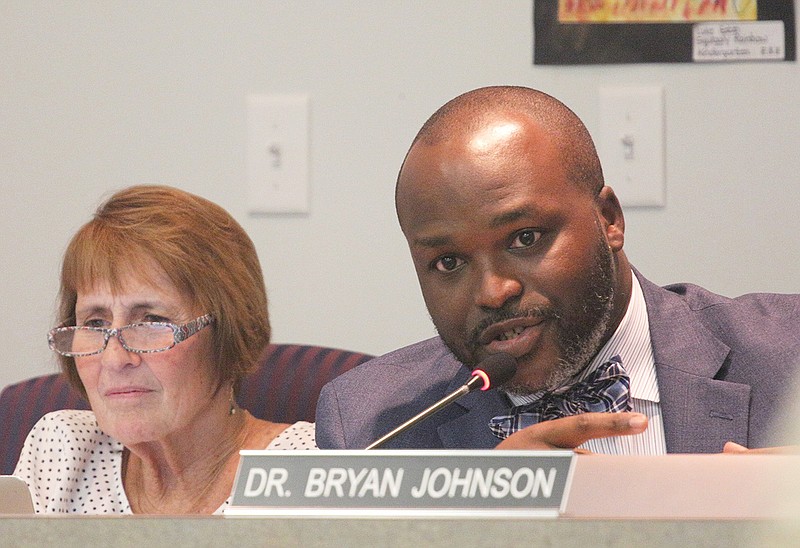 Hamilton County Schools Superintendent Bryan Johnson speaks next to school board member Kathy Lennon about his Future Ready 2023 plan during a Hamilton County school board meeting Thursday, Sept. 20, 2018, at the Hamilton County Department of Education in Chattanooga, Tennessee.