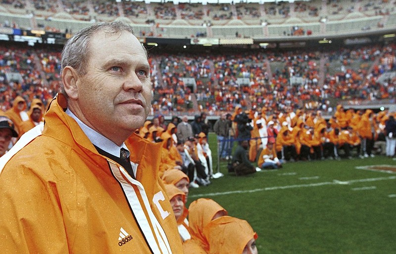 Tennessee football coach Phillip Fulmer watches a giant video screen on Jan. 30, 1999 in Knoxville as footage of the Vols' BCS title-game win against Florida State is shown. A crowd estimated at 30,000 to 40,000 were at Neyland Stadium that day to celebrate the national championship.