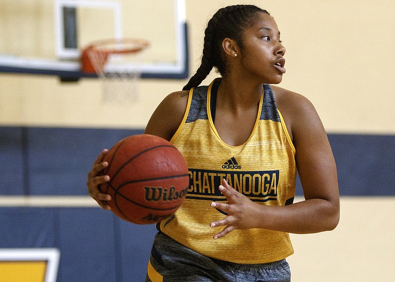 UTC freshman Morgan Hill looks for an open teammate at the Chattem Basketball Practice Facility on Sept. 27.