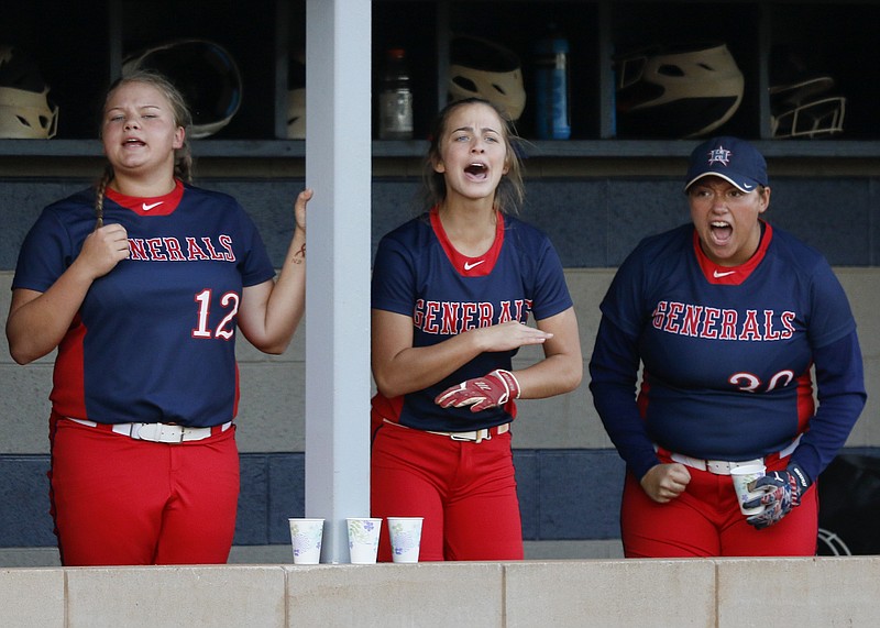 From left, Heritage softball teammates Carmen Gayler, Morgan Phillips and Sarah Haynes cheer from the dugout during a state playoff game against Central-Carroll on Wednesday in Ringgold, Ga. The host Lady Generals swept a doubleheader in wildly varying fashion, winning 2-1 and 12-0 to take the best-of-three series.