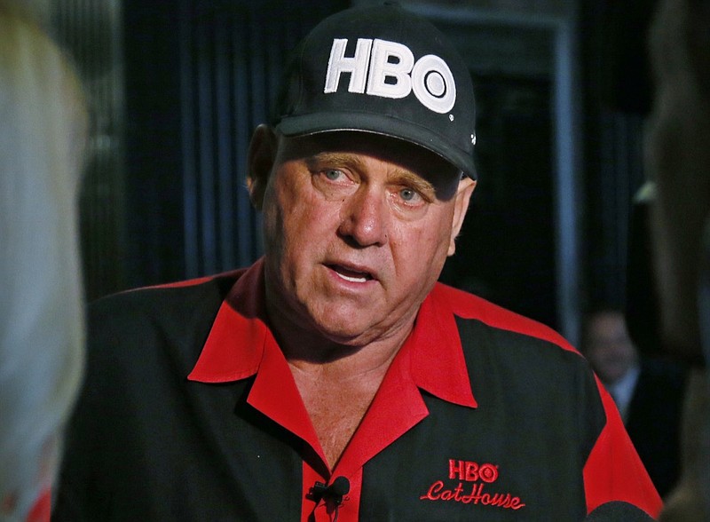 In this June 13, 2016, file photo, Dennis Hof, owner of the Moonlite BunnyRanch, a legal brothel near Carson City, Nev., is pictured during an interview during a break in the trial of Denny Edward Phillips and Russell Lee Hogshooter in Oklahoma City. Nevada authorities said Tuesday, Oct. 16, 2018, that Hof, a legal pimp who has fashioned himself as a Donald Trump-style Republican candidate has died. (AP Photo/Sue Ogrocki, File)