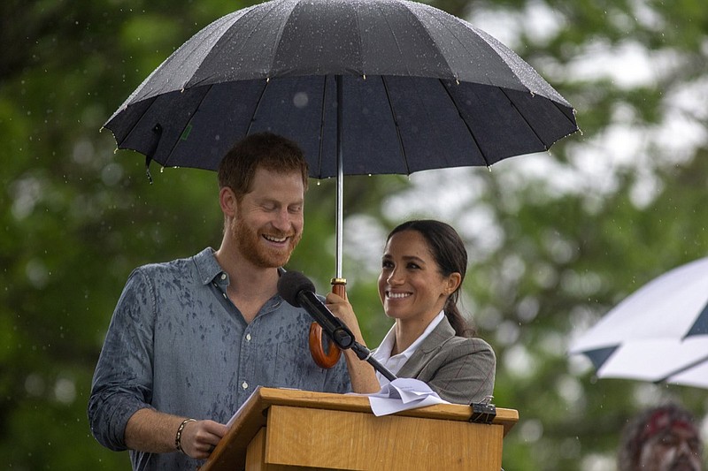 Britain's Prince Harry and Meghan, Duchess of Sussex attend a community picnic at Victoria Park in Dubbo, Australia, Wednesday, Oct. 17, 2018. Prince Harry and his wife Meghan are on day two of their 16-day tour of Australia and the South Pacific. (Ian Vogler/Pool via AP)