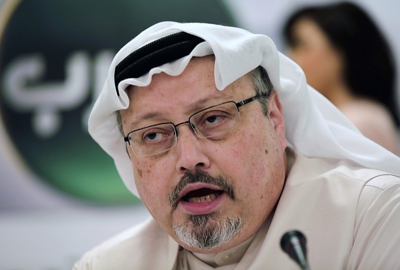 In this Feb. 1, 2015, file photo, Saudi journalist Jamal Khashoggi speaks during a press conference in Manama, Bahrain. A pro-government Turkish newspaper on Wednesday, Oct. 17, 2018 published a gruesome recounting of the alleged slaying of Saudi writer Jamal Khashoggi at the Saudi Consulate in Istanbul, just as America's top diplomat arrived in the country for talks over the Washington Post columnist's disappearance. (AP Photo/Hasan Jamali, File)