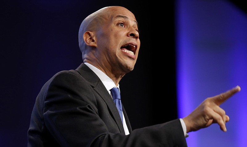 In this Oct. 6, 2018, photo, Sen. Cory Booker, D-N.J., speaks during the Iowa Democratic Party's annual Fall Gala, in Des Moines, Iowa. Booker is telling students on a historically black campus in the early presidential voting state of South Carolina that apathetic voters rather than Republicans are to blame for the nation's problems. (AP Photo/Charlie Neibergall)
