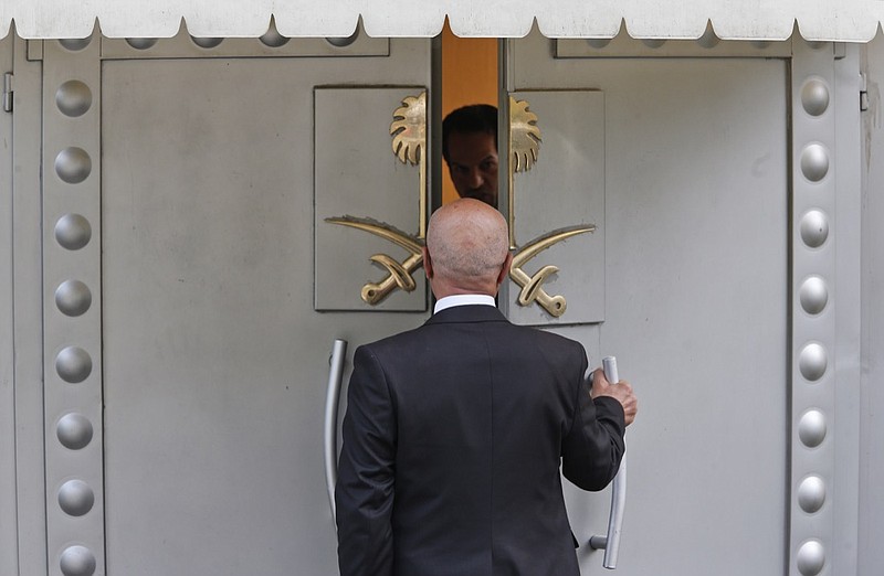 A man enters Saudi Arabia's consulate in Istanbul, Friday, Oct. 19, 2018. A Turkish official said Friday that investigators are looking into the possibility that the remains of missing Saudi journalist Jamal Khashoggi may have been taken to a forest in the outskirts of Istanbul or to another city — if and after he was killed inside the consulate earlier this month. (AP Photo/Lefteris Pitarakis)