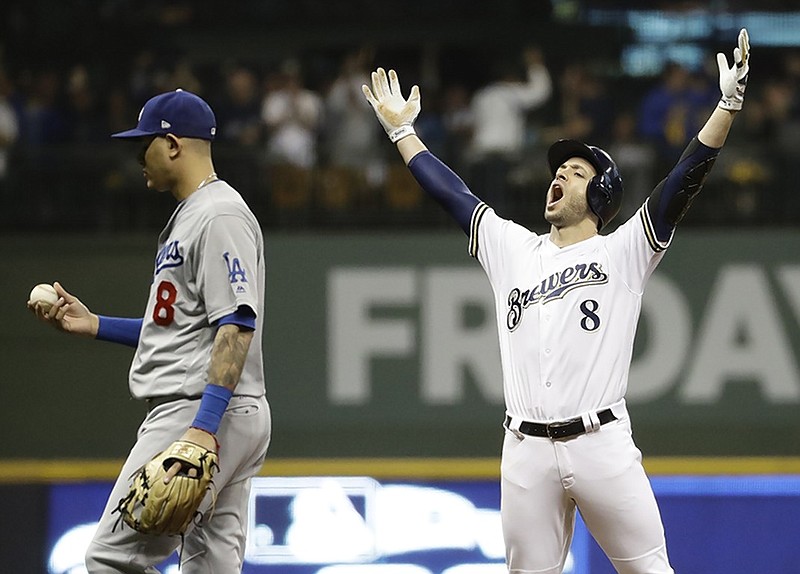 The Milwaukee Brewers' Ryan Braun reacts after hitting an RBI double during the second inning of Game 6 of the NLCS against the Los Angeles Dodgers on Thursday night in Milwaukee.