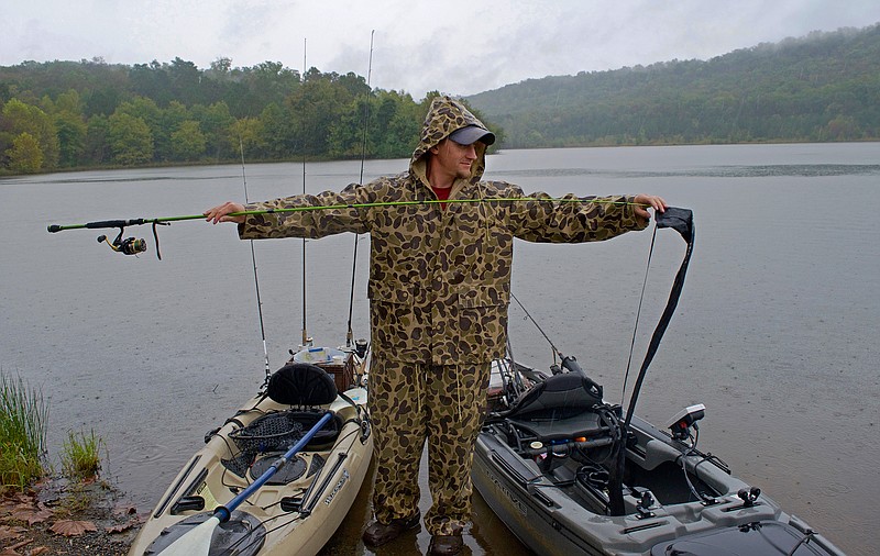 Seth Lassitter prepares his rod for a day of fishing at Haig Mill Lake in Dalton, Ga. The park surrounding the lake hosted a grand opening celebration Saturday morning.