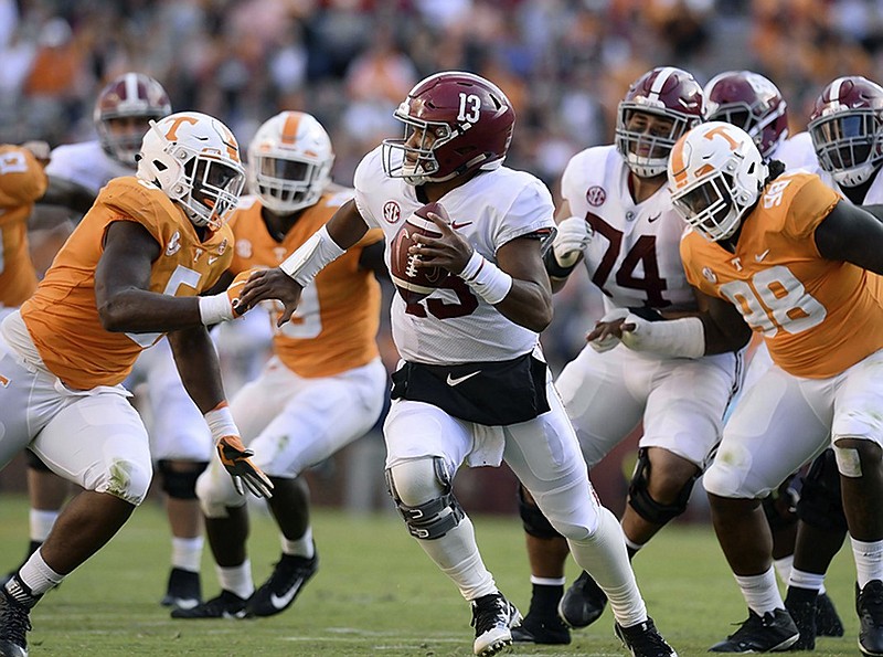 Tennessee defensive linemen Kyle Phillips, left, and Alexis Johnson Jr. pressure Alabama quarterback Tua Tagovailoa during the first half of the teams' Oct. 20 game in Knoxville.