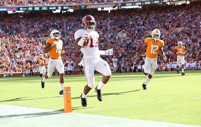 Alabama freshman receiver Jaylen Waddle crosses the goal line to complete a 77-yard touchdown reception that gave the Crimson Tide a 21-0 lead during their 58-21 win Saturday afternoon at Tennessee.
