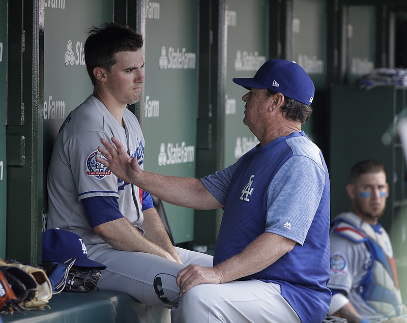 Los Angeles Dodgers pitching coach Rick Honeycutt, right, talks to starter Ross Stripling during a road game against the Chicago Cubs on June 20. Honeycutt, a Chattanooga native, and the Dodgers are back in the World Series for the second straight year. Game 1 is Tuesday night in Boston.