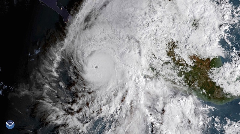 This GOES East satellite image provided by NOAA shows Hurricane Willa in the eastern Pacific, on a path toward Mexico's Pacific coast on Monday, Oct. 22, 2018. (NOAA via AP)