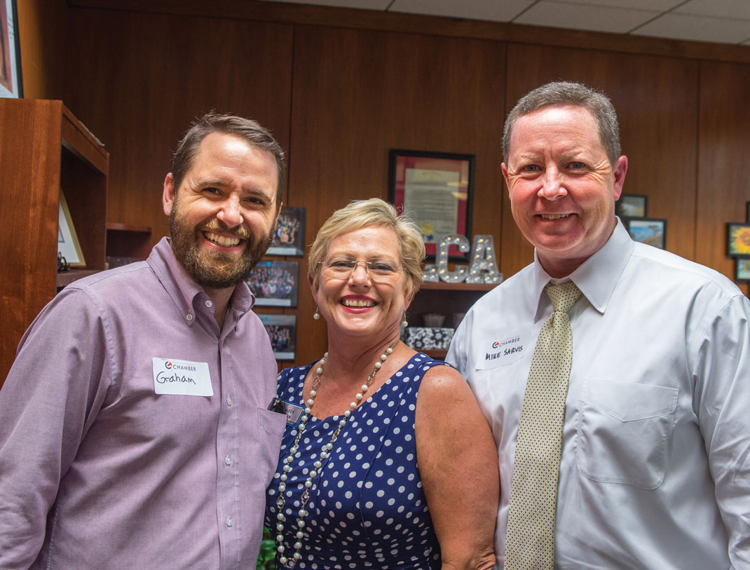 Graham Harrell, Diane Parks and Mike Sarvis attend the Chattanooga Area Chamber of Commerce's annual open house.
