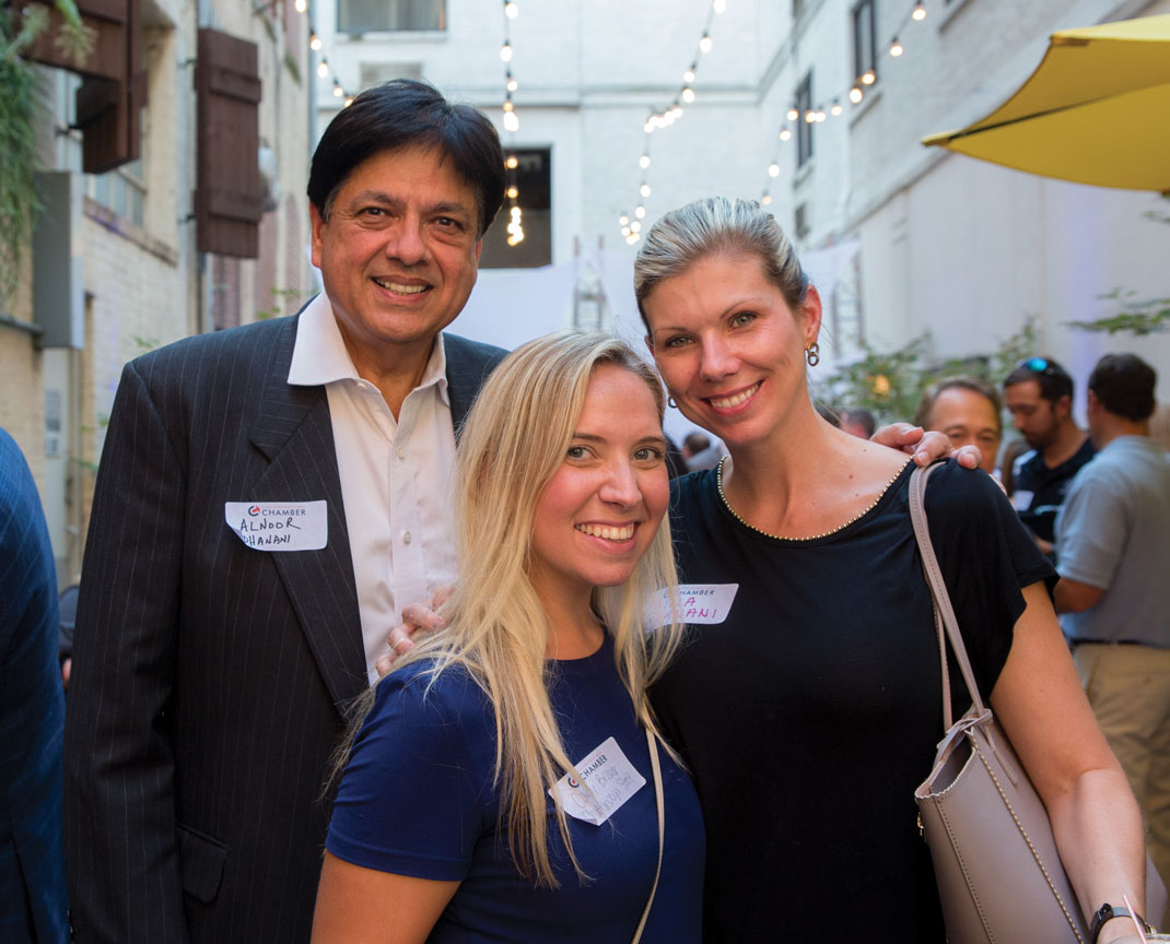 Carly Brewer and Alnoor & Gina Dhanani attend the Chattanooga Area Chamber of Commerce's annual open house.