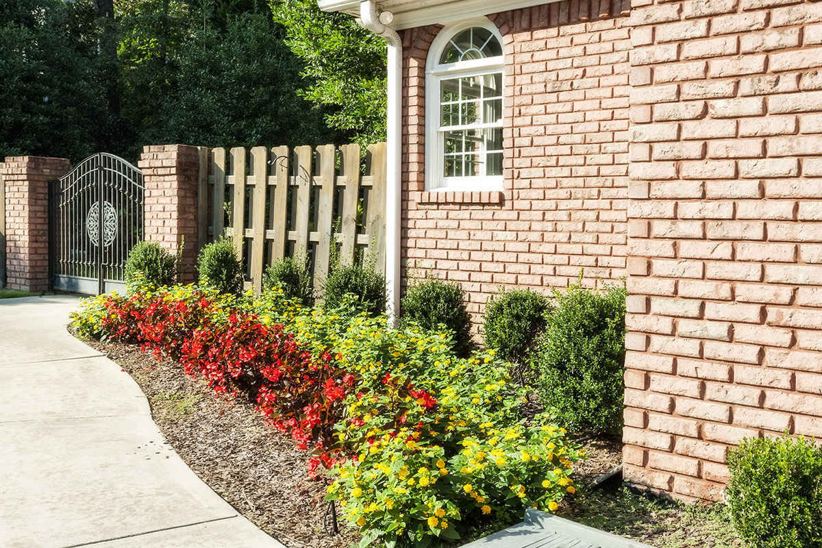 The landscaping is filled with abundant greenery and flowering shrubs, trees and plants, which create a colorful blanket through spring, summer and fall.