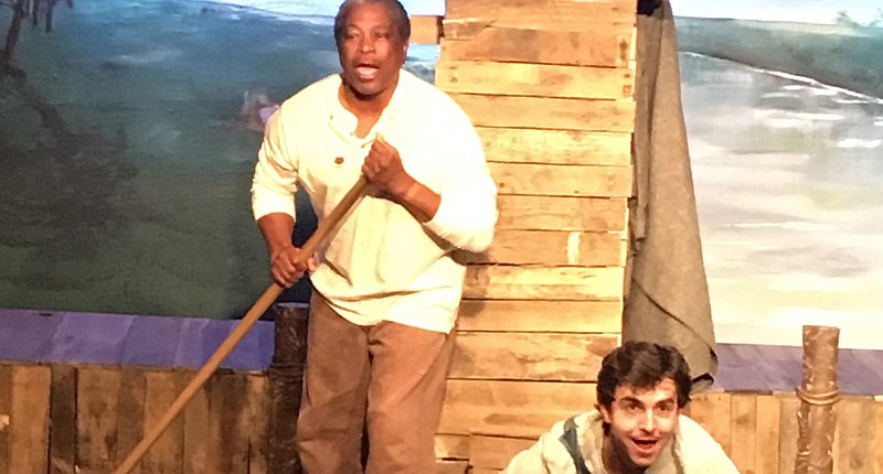 Thomas Pinson as Jim and Christian Smith as Huck raft the Mississippi River. (Artistic Civic Theatre contributed photo)