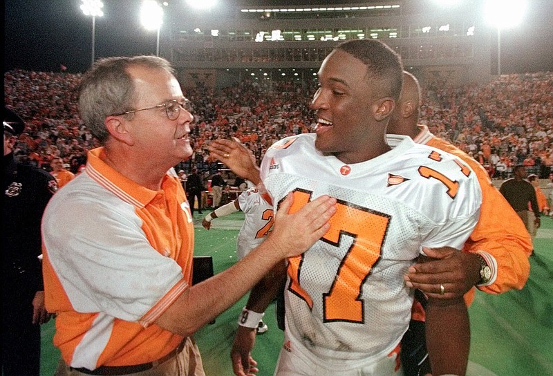 Tennessee offensive coordinator David Cutcliffe, left, got good numbers from quarterback Tee Martin during the Vols' 49-14 rout of host South Carolina on Oct. 31, 1998.