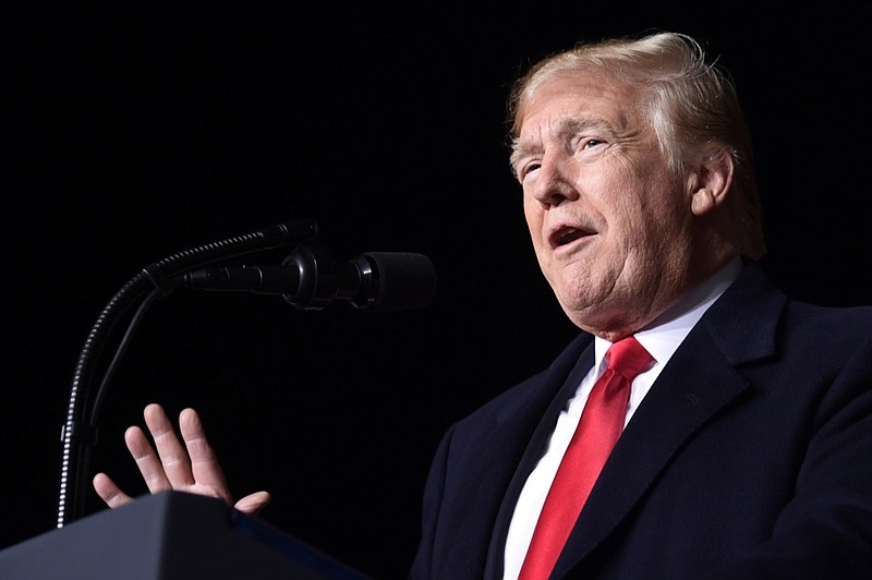 President Donald Trump speaks at a rally at Central Wisconsin Airport in Mosinee, Wis., Wednesday, Oct. 24, 2018. (AP Photo/Susan Walsh)

