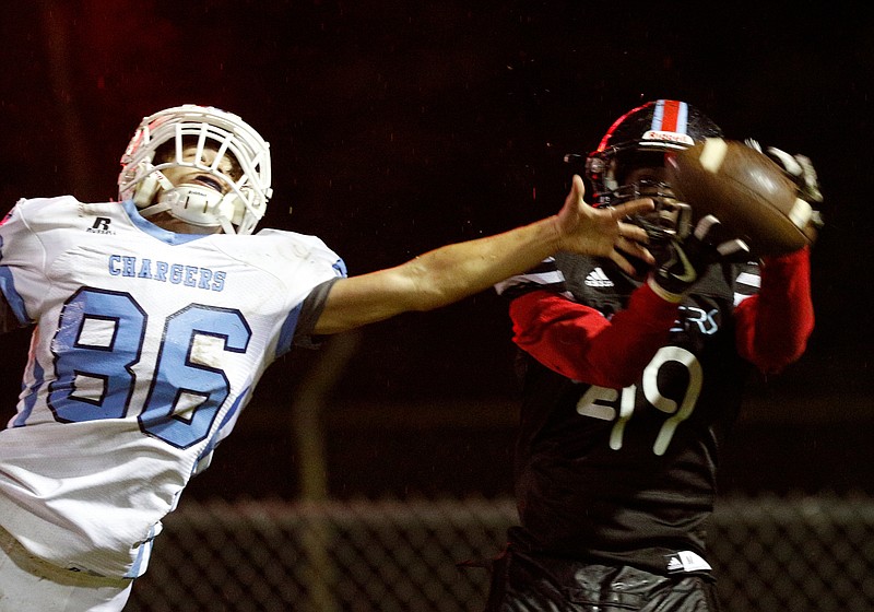 Brainerd's Tre Owten (49) catches a touchdown pass against coverage by McMinn Central's Brandon Leight (86) in the host Panthers' 35-25 region win Thursday night at Brainerd High School.