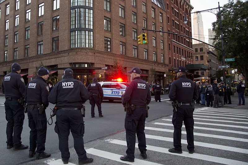 Police are standing watch near a building associated with Robert DeNiro, Thursday, Oct. 25, 2018, in New York after reports of a suspicious package. (AP Photo/Mark Lennihan)

