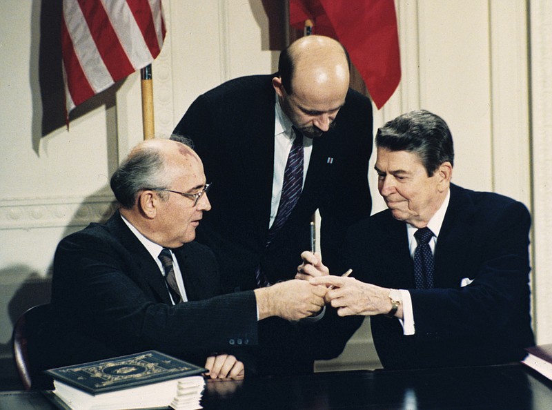 President Trump's announced decision to withdraw the U.S. from the 1987 Intermediate Range Nuclear Forces Treaty, signed by U.S. President Ronald Reagan, right, and Soviet leader Mikhail Gorbachev, left, could be a strategic move to put pressure on North Korea and China.