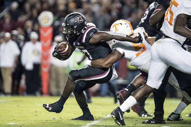 Tennessee defensive lineman Kyle Phillips wraps up South Carolina running back Ty'Son Williams during the first half of Saturday's 27-24 win for the host Gamecocks in Columbia, S.C.