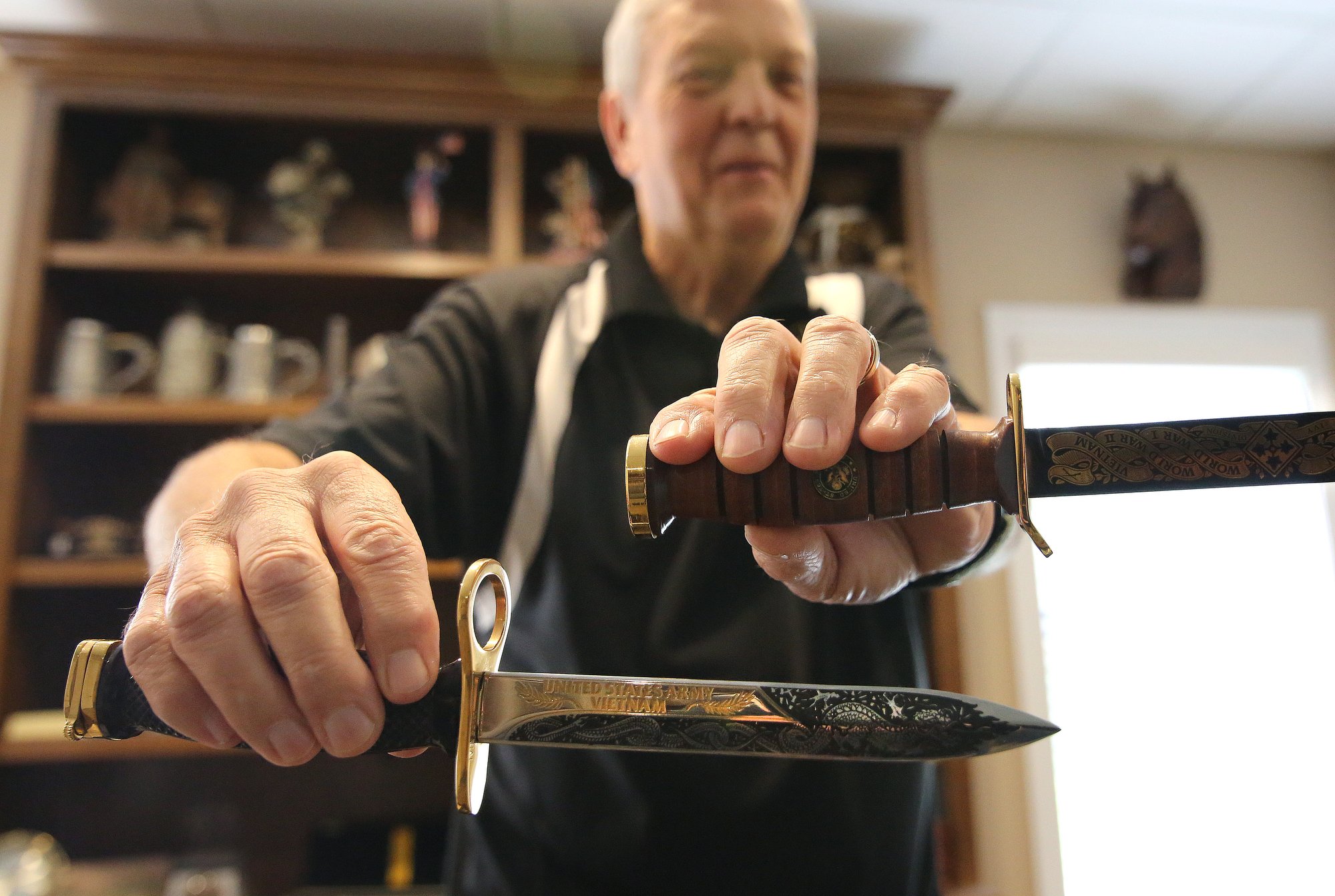 Philip George Garver shows of knives that were engraved for him Wednesday, October 17, 2018 in Collegedale, Tennessee.