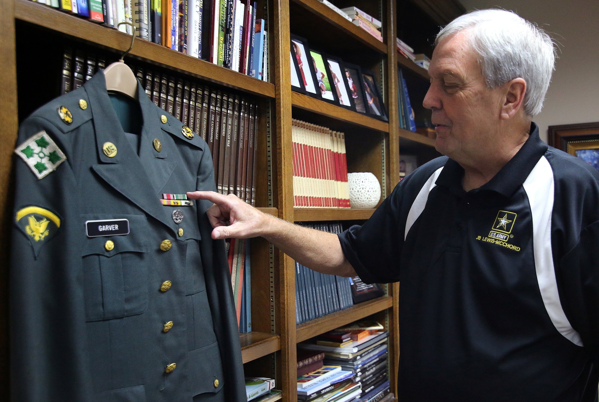 Philip George Garver points out the ribbons on his military uniform Wednesday, October 17, 2018 in Collegedale, Tennessee. Garver was a conscientious objector, who served as a medic and refused to carry a gun.