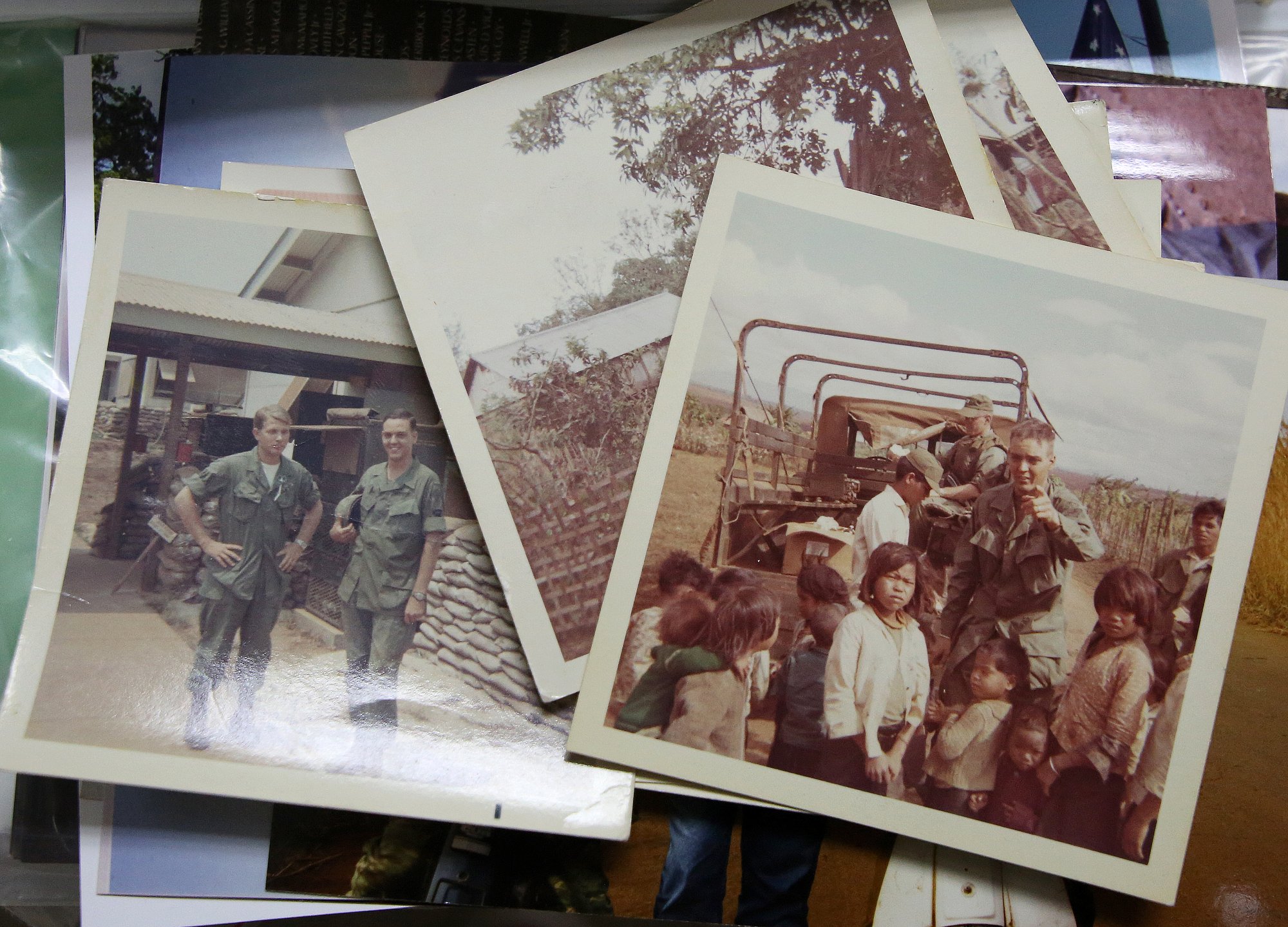 Philip George Garver's photos from his time in Vietnam sit on his table Wednesday, October 17, 2018 in Collegedale, Tennessee. Garver served as a medic in Vietnam.