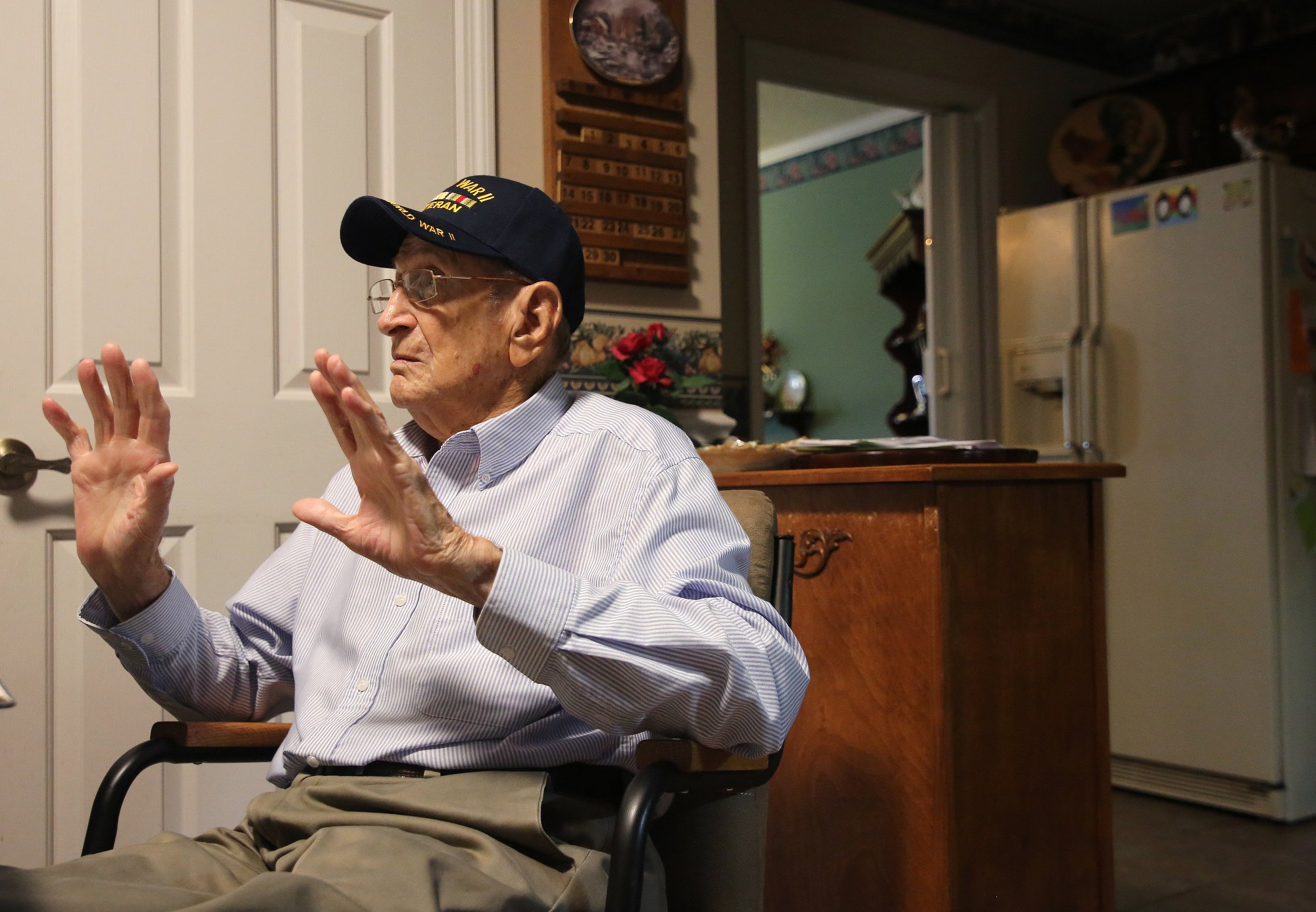 Ralph Painter talks about his time serving in World War II during an interview Monday, October 15, 2018 at his home in East Brainerd, Tennessee. Painter has suffered from blood circulation problems for most of his life from the frostbite that he got while serving in World War II.