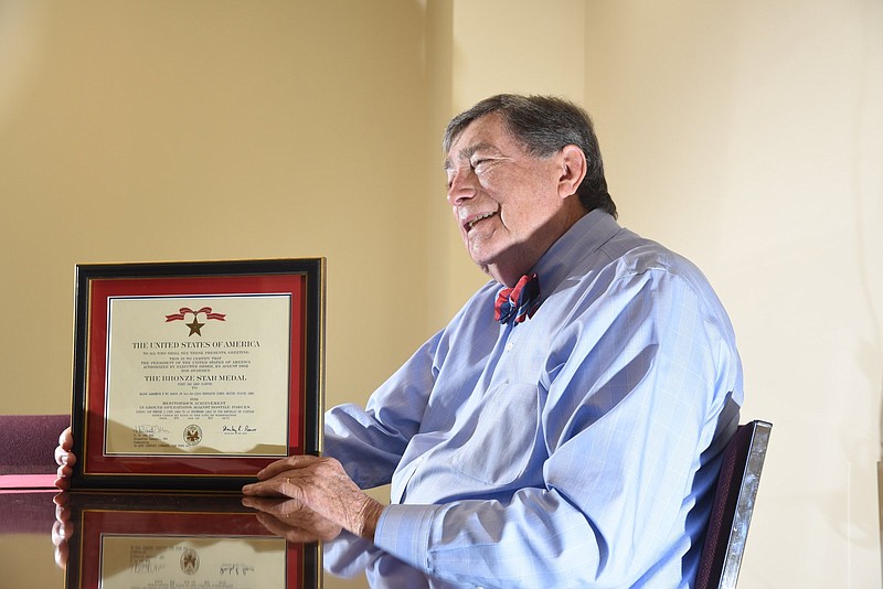 Lt. Col. Lawrence F. McDaris talks about his service in Vietnam in downtown Cleveland, Tenn.