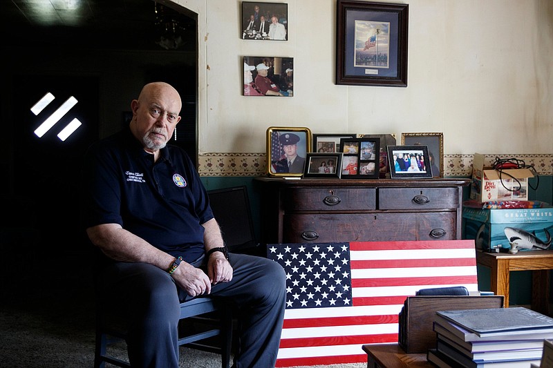 Vietnam veteran Vance Elliott poses for a portrait in his home on Friday, Oct. 12, 2018, in Soddy-Daisy, Tenn. Elliott served as a door gunner on a Huey helicopter in 1965.