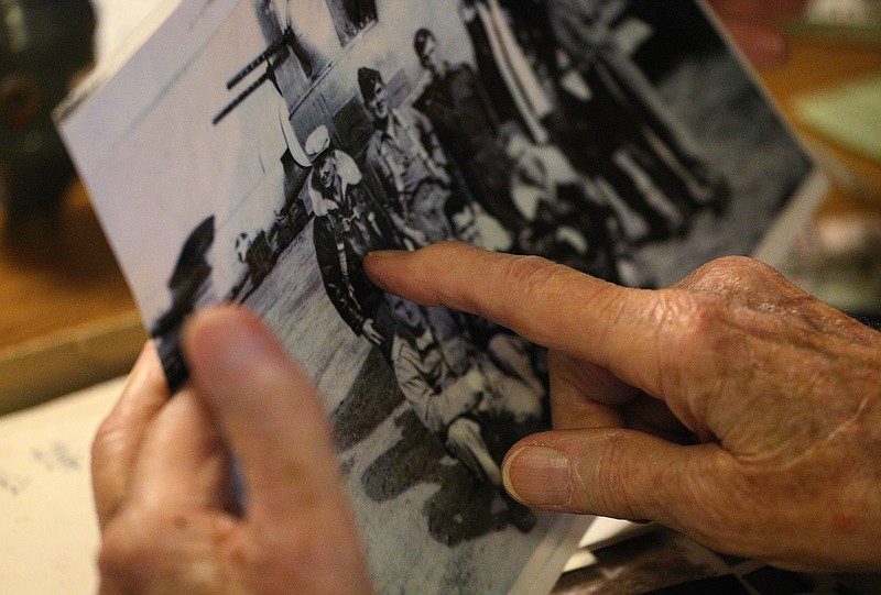 James Gribble points to himself in a photo of a group he flew with in World War II Friday, October 26, 2018 at his Chattanooga, Tennessee, home. Gribble was assigned to a 9-member crew of a B24 Liberator.