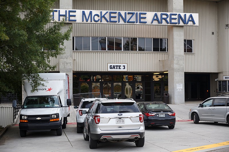 Government vehicles are parked outside McKenzie Arena on Wednesday, Oct. 31, 2018, in Chattanooga, Tenn. President Donald Trump is expected to hold a pre-election day rally at the arena on Sunday.