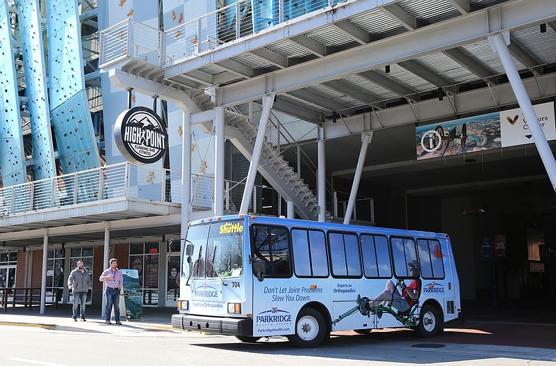 A CARTA electric shuttle bus pulls out of Shuttle Park North onto Broad Street in downtown Chattanooga on Jan. 25, 2018. A recent downtown parking study suggests extending CARTA shuttle services to the Erlanger area and along Main Street.