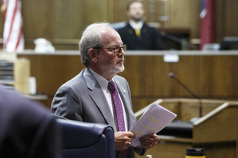 Defendant Tim Boyd, Hamilton County District 8 commissioner, talks with his lawyer Lee Davis after appearing before Judge Andrew Freiberg on the first day of his extortion trial in Judge Don Poole's courtroom in the Hamilton County-Chattanooga Courts Building on Wednesday, Oct. 31, 2018 in Chattanooga, Tenn.