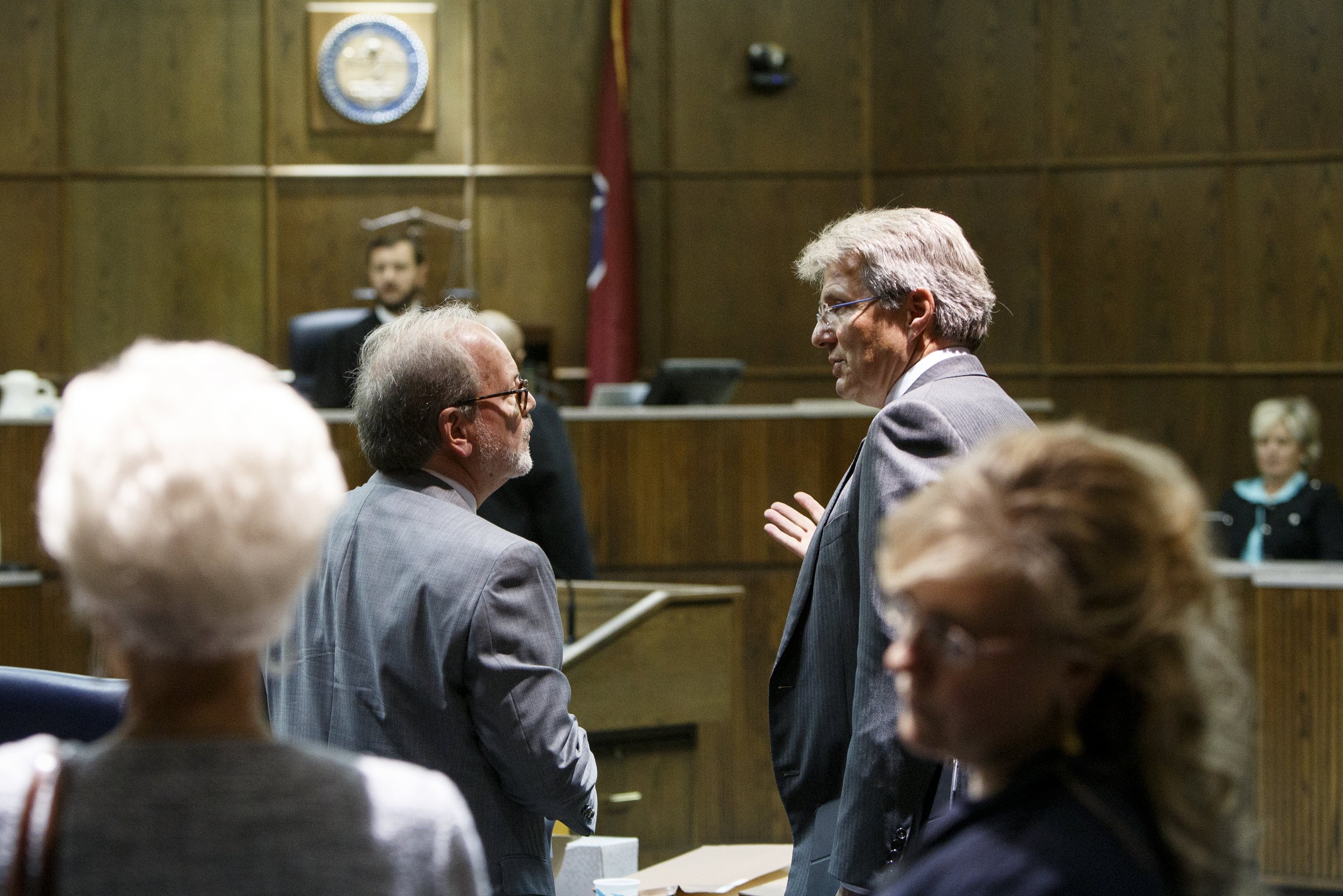 Defendant Tim Boyd, Hamilton County District 8 commissioner, talks with his lawyer Lee Davis, right, after appearing before Judge Andrew Freiberg on the first day of his extortion trial in Judge Don Poole's courtroom in the Hamilton County-Chattanooga Courts Building on Wednesday, Oct. 31, 2018 in Chattanooga, Tenn.