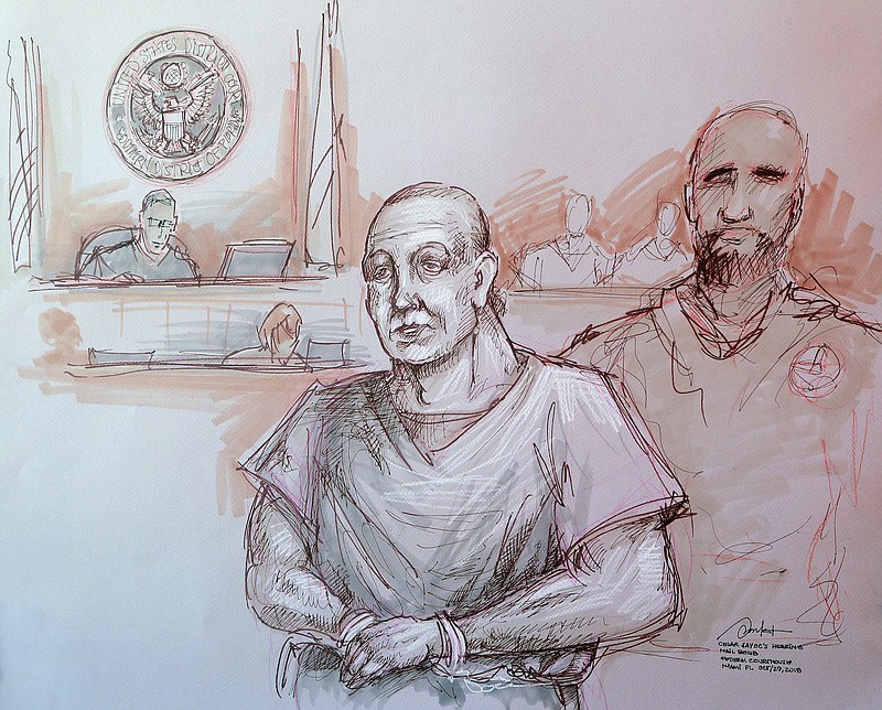 In this courtroom sketch, Cesar Sayoc, left, appears in federal court, on Monday in Miami. Sayoc is accused of sending pipe bombs to prominent Democrats around the country. (Daniel Pontet via AP)
