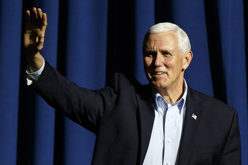 Vice President Mike Pence waves to the crowd while taking the stage for a "Get Out The Vote" rally while stumping for Republican gubernatorial candidate Brian Kemp at the Dalton Convention Center on Thursday, Nov. 1, 2018 in Dalton, Ga. Republican Brian Kemp is facing off against Democrat Stacey Abrams for governor in Georgia.