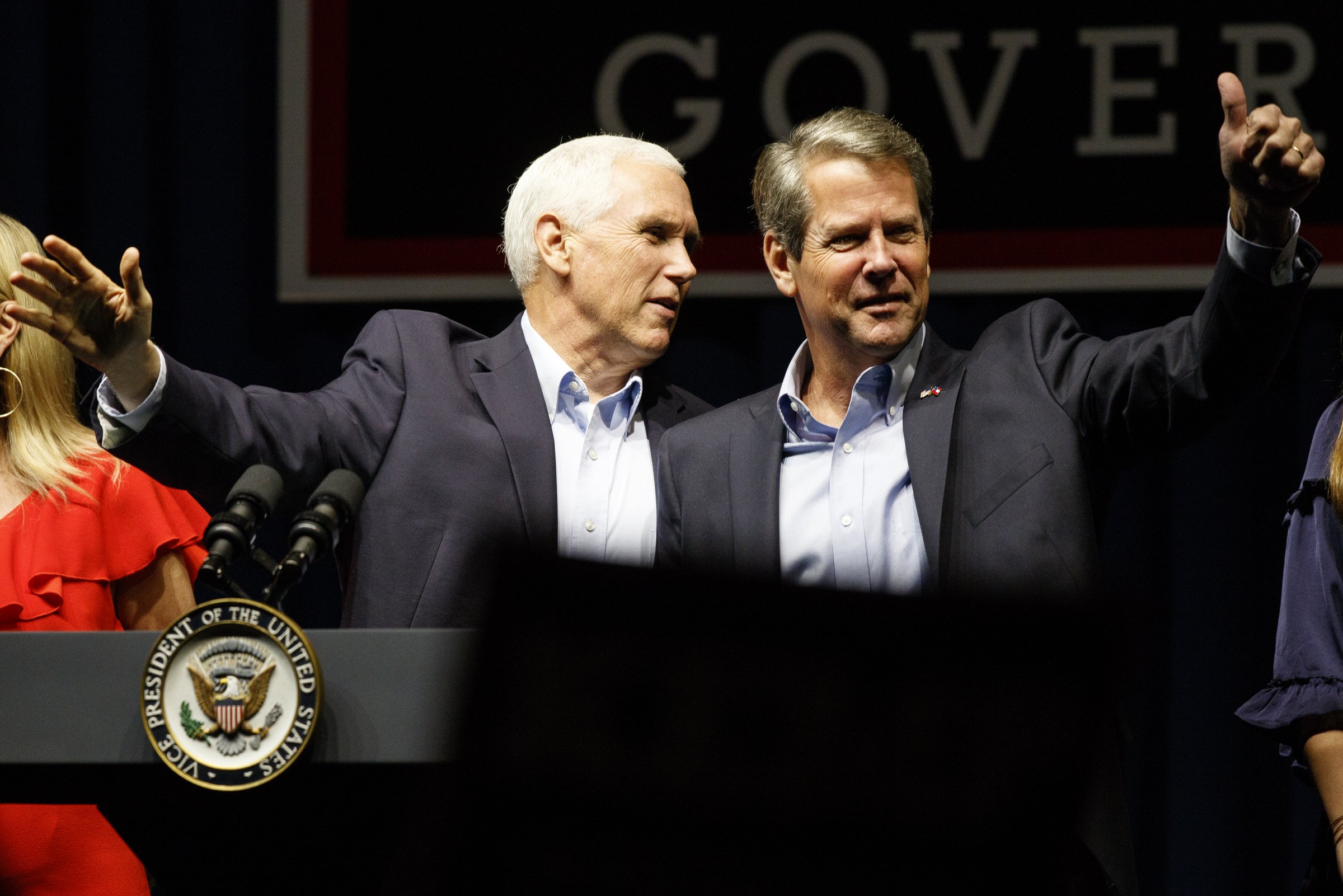 Vice President Mike Pence, left, and Republican gubernatorial candidate Brian Kemp greet the crowd during a "Get Out The Vote" rally at the Dalton Convention Center on Thursday, Nov. 1, 2018 in Dalton, Ga. Republican Brian Kemp is facing off against Democrat Stacey Abrams for governor in Georgia.
