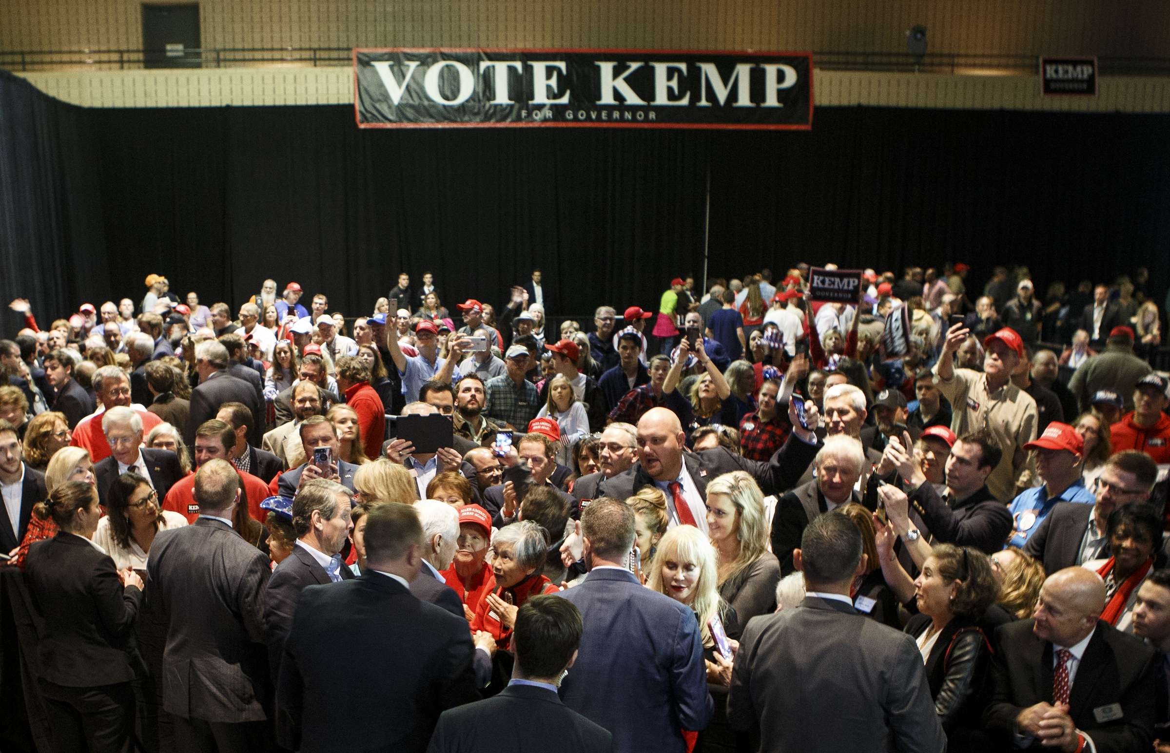 In the bottom-left-center, Vice President Mike Pence greets supporters after speaking during a "Get Out The Vote" rally stumping for Republican gubernatorial candidate Brian Kemp at the Dalton Convention Center on Thursday, Nov. 1, 2018 in Dalton, Ga. Republican Brian Kemp is facing off against Democrat Stacey Abrams for governor in Georgia.