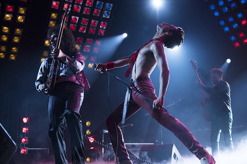 This image released by Twentieth Century Fox shows Gwilym Lee, from left, Rami Malek and Joe Mazzello in a scene from "Bohemian Rhapsody." (Alex Bailey/Twentieth Century Fox via AP)

