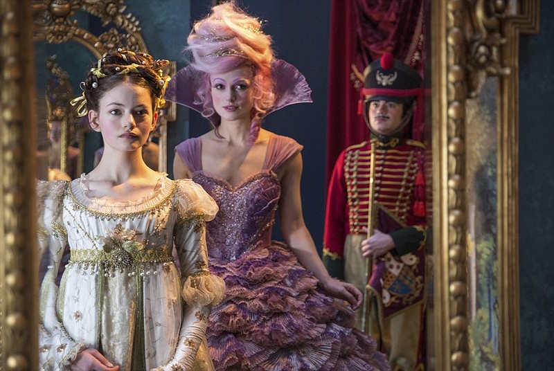 This image released by Disney shows Mackenzie Foy, left, and Keira Knightley in a scene from "The Nutcracker and the Four Realms." (Laurie Sparham/Disney via AP)

