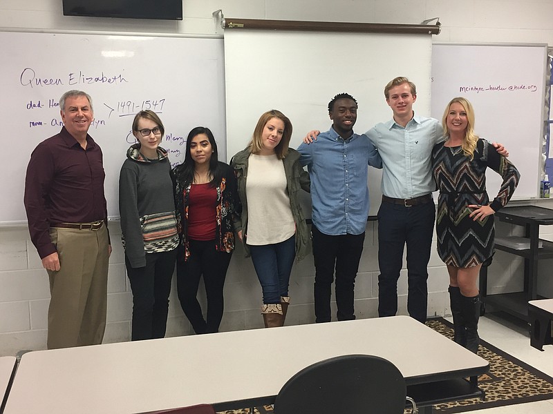 Howard Grody (left) and Heather McIntyre (right) stand with a few of the Ooltewah High School students who presented their work as part of the Advanced Marketing class's latest project. Students pictured include Jay Milner, Jazmine Abrego, Alivia Moore, Michael Mobley and Conner Charlton. (Contributed photo)