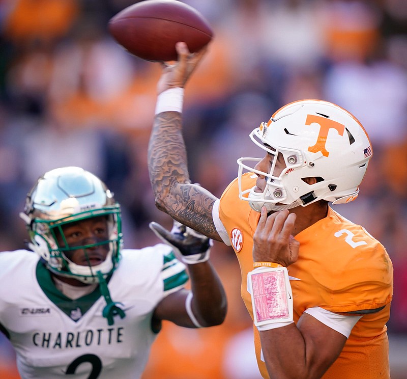 Tennessee's Jarrett Guarantano releases the ball before Charlotte defensive back Ed Rolle can get to him in the first quarter of Saturday's game in Knoxville.