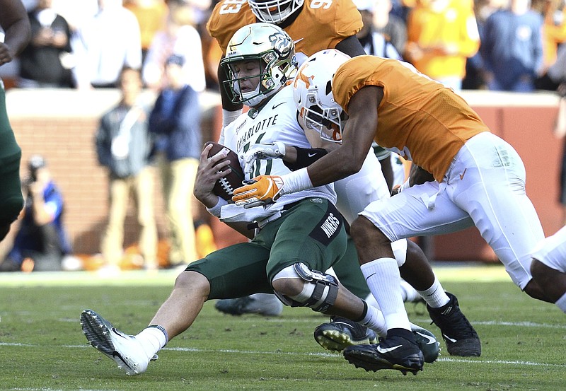 Charlotte quarterback Evan Shirreffs (16) is tackled by freshman defensive back Alontae Taylor in the first quarter of Tennessee's 14-3 win Saturday at Neyland Stadium. Taylor was called for targeting on the play and ejected from the game.