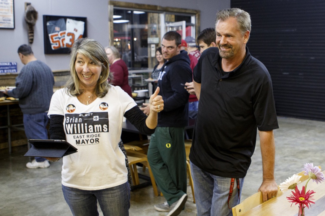 East Ridge mayoral candidate Brian Williams, right, smiles as his wife, Shelley, reads out early returns that show him leading on election night at Local Coffee of East Ridge on Tuesday, Nov. 6, 2018, in East Ridge, Tenn.