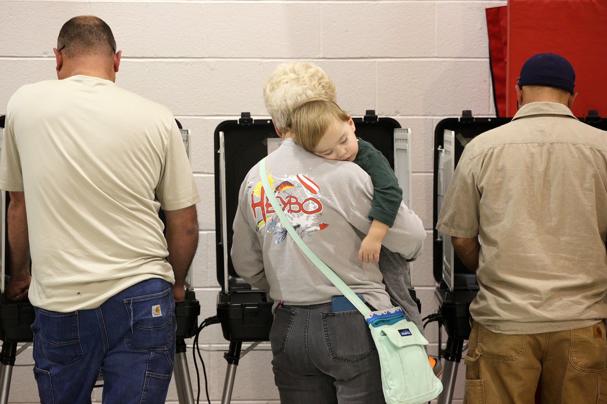 In the center, Wilma Morgan holds her 1-year-old grandson Luke Cucksee Tuesday, November 6, 2018 at the City of Varnell Parks and Recreation in Varnell, Georgia. Morgan said she always votes in order to try to get the right people in office.