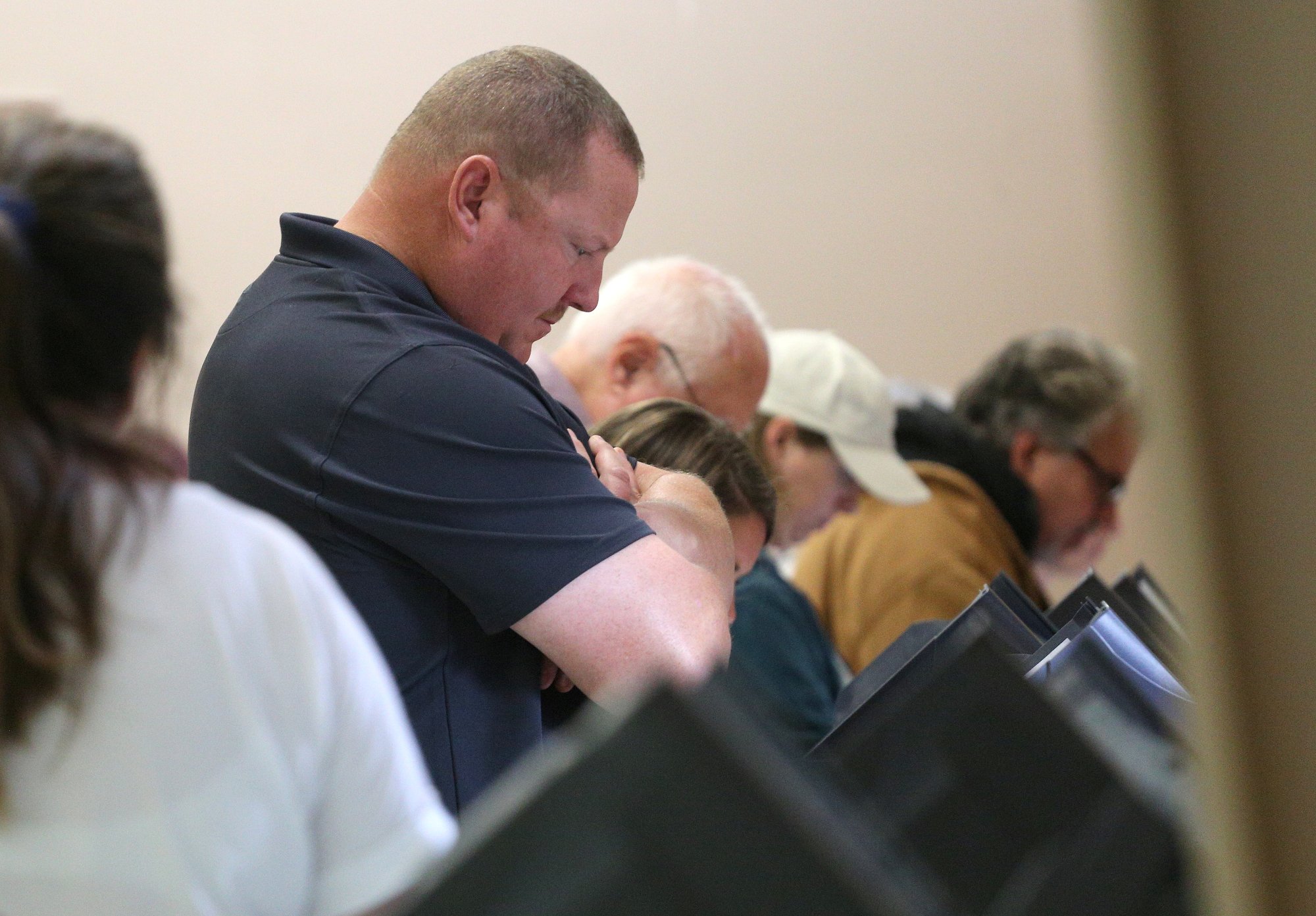 Gene Wilson reads over the ballot while casting his vote Tuesday, November 6, 2018 at the Chattanooga Valley Church of the Nazarene in Flintstone, Georgia.