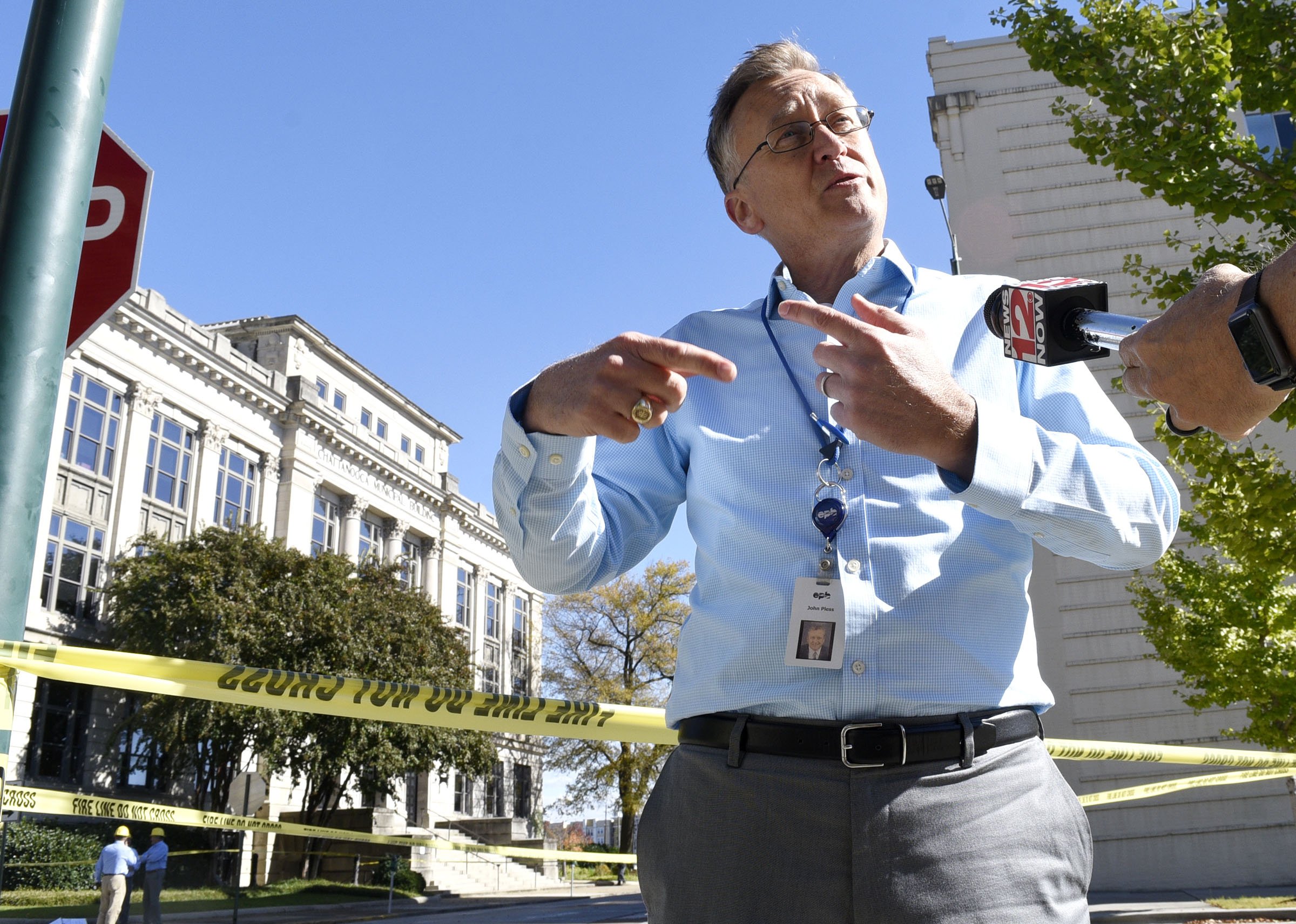 Electric Power Board Public Relations Coordinator John Pless speaks to the media at the scene of a underground fire. A underground electrical fire lead to evacuations and road closers at the corner of East 11th Street and Lindsay Street by City Hall on November 6, 2018.